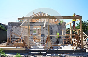 Roofers Building Wood Trusses Roof Frame House Construction. Roofing construction photo