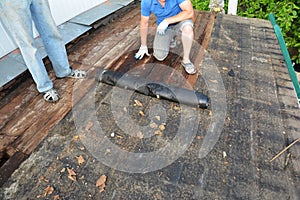 Roofers roof repair and renovation. Old house roof with bad wet wooden beams and  wet roock wool insulation material. Roofing