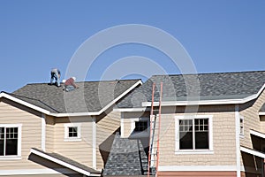 Roofers working on new roof photo