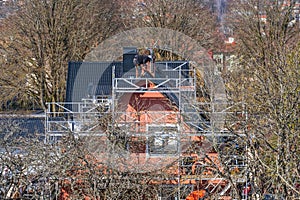 Roofers working on a residential building