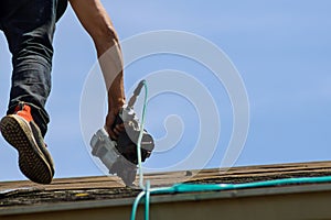 Roofers workingreplacing the house installed new shingles