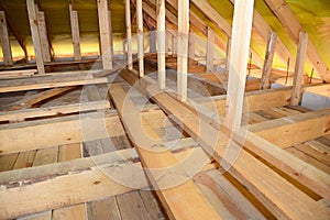 Roofing Construction Attic Insulation Interior. Wooden Roof Beams, Roof Truuses,  Frame House Attic Construction