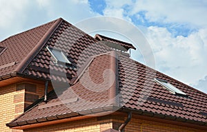 Roofing construction with attic skylights, rain gutter system, roof windows and roof protection from snow