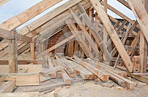 Roofing construction and framing of a new house. Timber trusses, roof framing with a close-up of roof beams, framing, ceiling