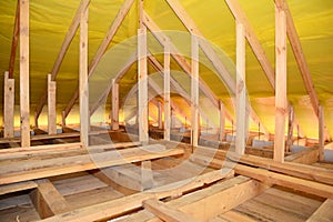 Roofing construction: framing the roof with trusses, braces, roof beams and covering the roof with a vapor barrier, damp proof