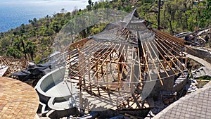 Roofing Construction. Wooden Roof Frame House Construction. Architectural details of inside of attic, wooden roof system