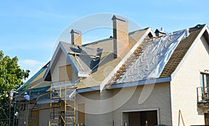 Roofing Contractors Installing House Roof Asphalt Shingles. Roofing Contractor Repair Roofing Construction. Roof Renovation with