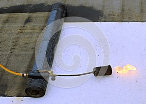 Roofing felt roll and one torch blowpipes