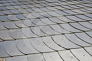 Roofing: pattern of gray slate on an antique roof