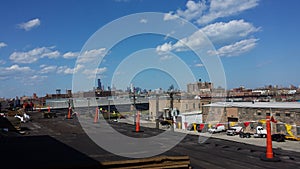 Roofing Work, Commercial flat roof with safety flags in the city