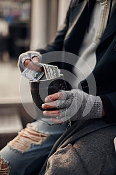 Closeup photo of beggar hands getting money