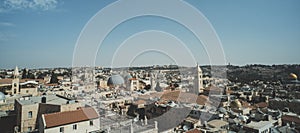 Roofs, buildings, Holy Sepulcher Church Dome and high minarets in old part of Jerusalem, Israel. Aerial view of ancient capital of
