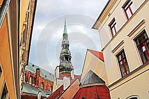 Roofs of buildings in old town and top view of church of St. Peter St. Peter Church, Petrikirche, Riga photo