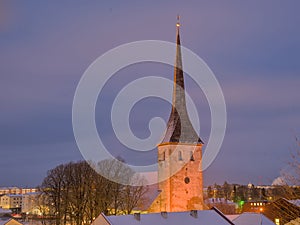 Roofs and church tower of Rakvere, Estonia, on a winter night