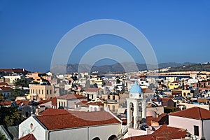 roofs of houses and the bell tower of the church in the city of Chania on the island of Crete