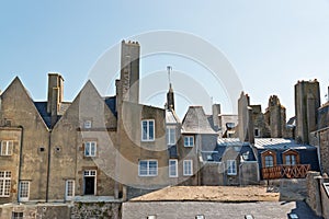 Roofs and houses of Saint Malo in summer with blue sky. Brittany