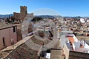 Roofs of the houses of the town of Villena and the medieval castle of Arab origin of the Atalaya