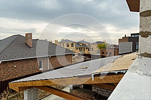 Roofs of new houses under construction in cottage village.