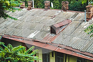 roofs of old houses with chimneys made of antique stone/