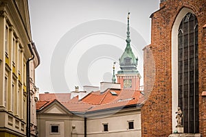 Roofs of residential building and tower of the Royal Castle in Warsaw, Poland