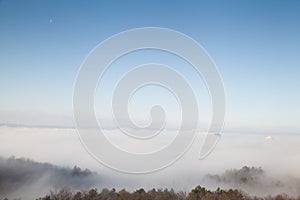 Roofs of several high rise building in the fog