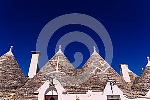 Roofs with symbols in the trulli, in the famous Italian city of Alberobello