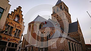 Roofs And Windows Of Old Authentic Brick Houses And Church In Bruges, Belgium