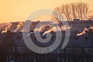 A roofscape in the Netherlands in winter, with homes being heated by natural gas