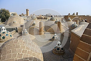 The scenic brick domes of Qasemi Bathhouse, Kashan, Iran.