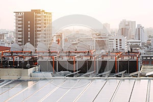 Rooftop of building HVAC Air Chillers with solar panel. modern Bangkok city landscape photo