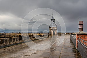 Rooftop of Koenigstein Fortress with a turret in Saxon Switzerland on a stormy day, Germany