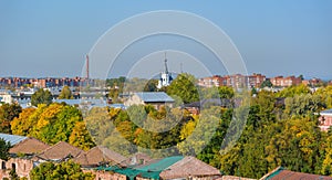 Rooftop Kronstadt view from belltower of Naval Cathedral of Saint Nicholas in golden autumn day with dam on background