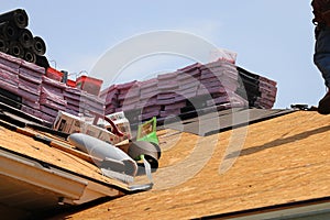 Rooftop loaded with Roofing Supplies