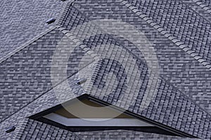 Rooftop in a newly constructed subdivision in Kelowna British Columbia Canada showing asphalt shingles