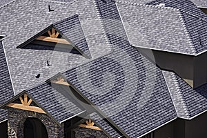 Rooftop in a newly constructed subdivision in Kelowna British Columbia Canada showing asphalt shingles