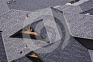 Rooftop in a newly constructed subdivision in Kelowna British Columbia Canada showing asphalt shingles