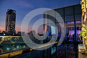 rooftop restaurant in luxury hotel at dusk, Bangkok