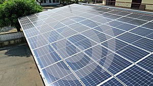 Rooftop solar panel installation under clear sky.