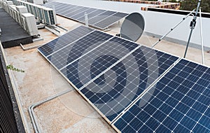 Rooftop solar panels and air conditioning on an apartment roof in australia photo