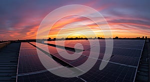 Rooftop Solar Panels Under a Dramatic Sunset Sky