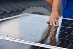 Rooftop solar power system. Process of installing solar panels on the roof of a house. Turnkey solar power system, service works.