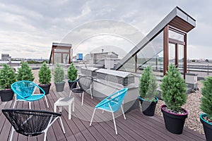 Rooftop terrace with modern chairs