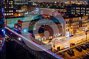 Rooftop view of the city at night. Looking down on the streets of Chicago in Fulton Market