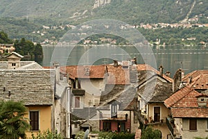 Rooftop view of an old city and lake at the background.