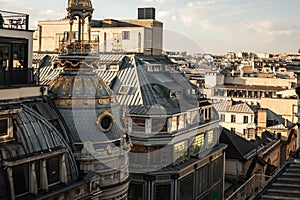 Rooftop view on residential buildings in Paris from Printemps Haussmann