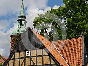 Rooftops of houses and the dome of a cathedral in Schleswig-Holstein