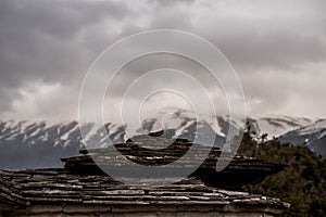 Rooftops made of stones under the heavy sky