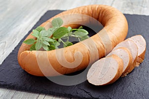 Rookworst sausage and basil