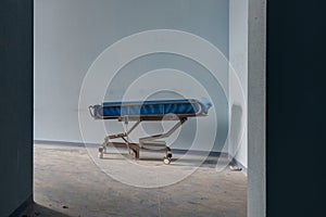 Room of an abandoned hospital, with beds and medical equipment