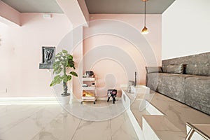 Room of a beauty salon with a sofa on a double height platform for pedicures